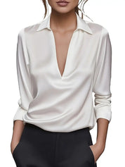 White blouse with deep V-neck studio shot