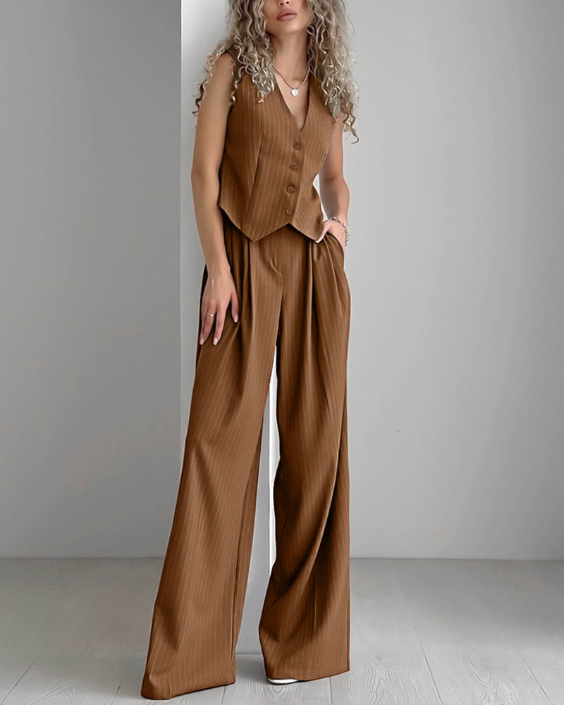 Brown pinstripe jumpsuit front view with hands in pockets