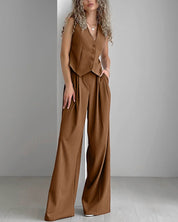 Brown pinstripe jumpsuit front view with hands in pockets