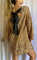 Gold sequin dress with black bow side view