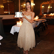 Beige glitter dress side view with cake