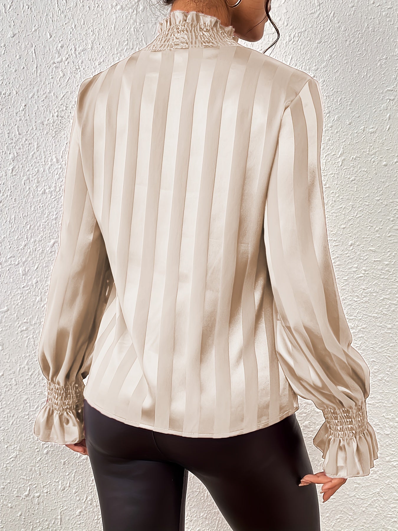 Ivory striped satin blouse with ruffled cuffs close-up detail