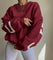 Oversized sweater rood met witte strepen en letters, vooraanzicht