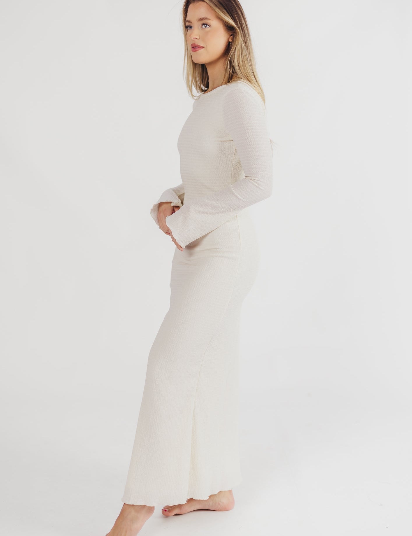 Cream textured maxi dress with bell sleeves front view