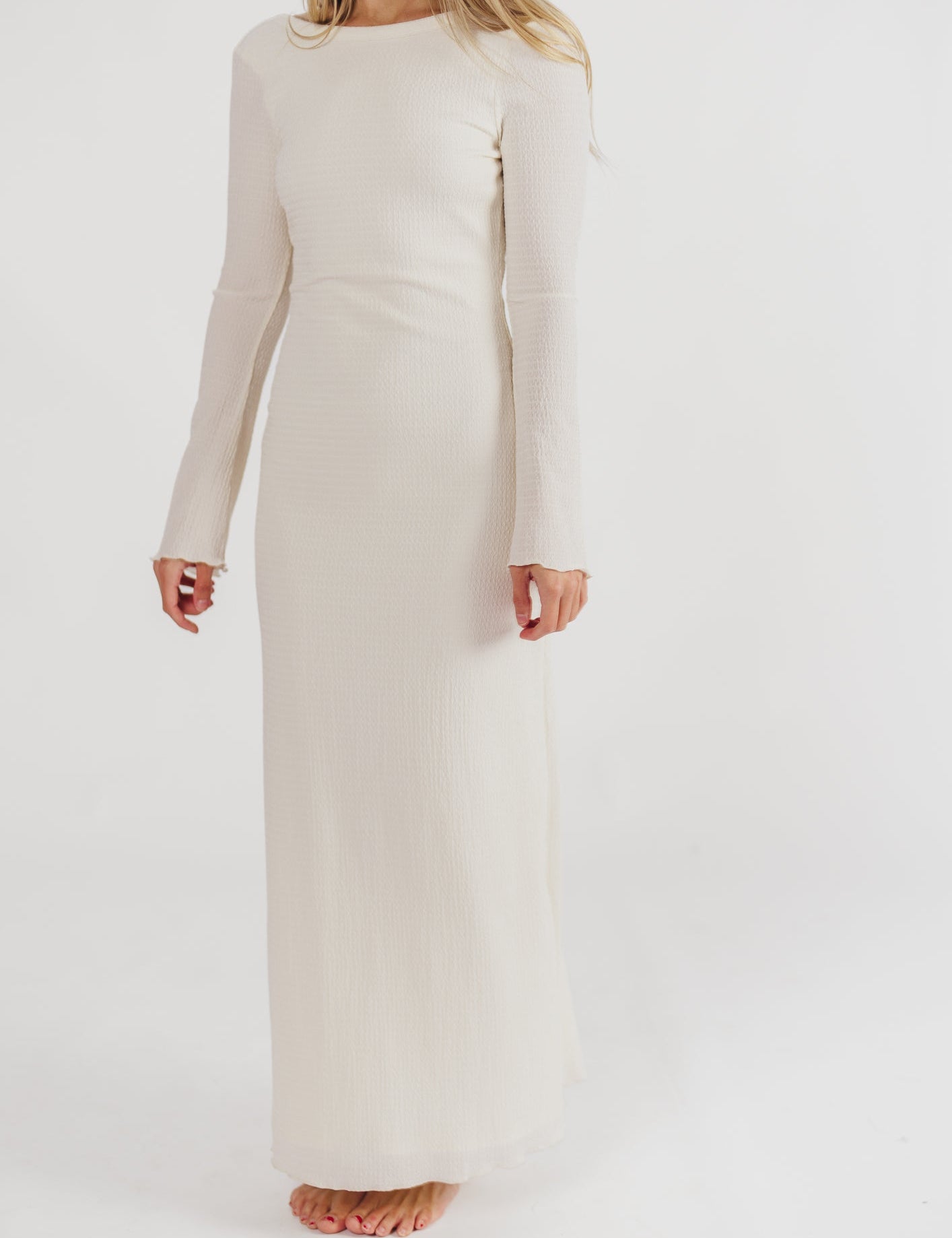 Cream textured maxi dress with bell sleeves front view