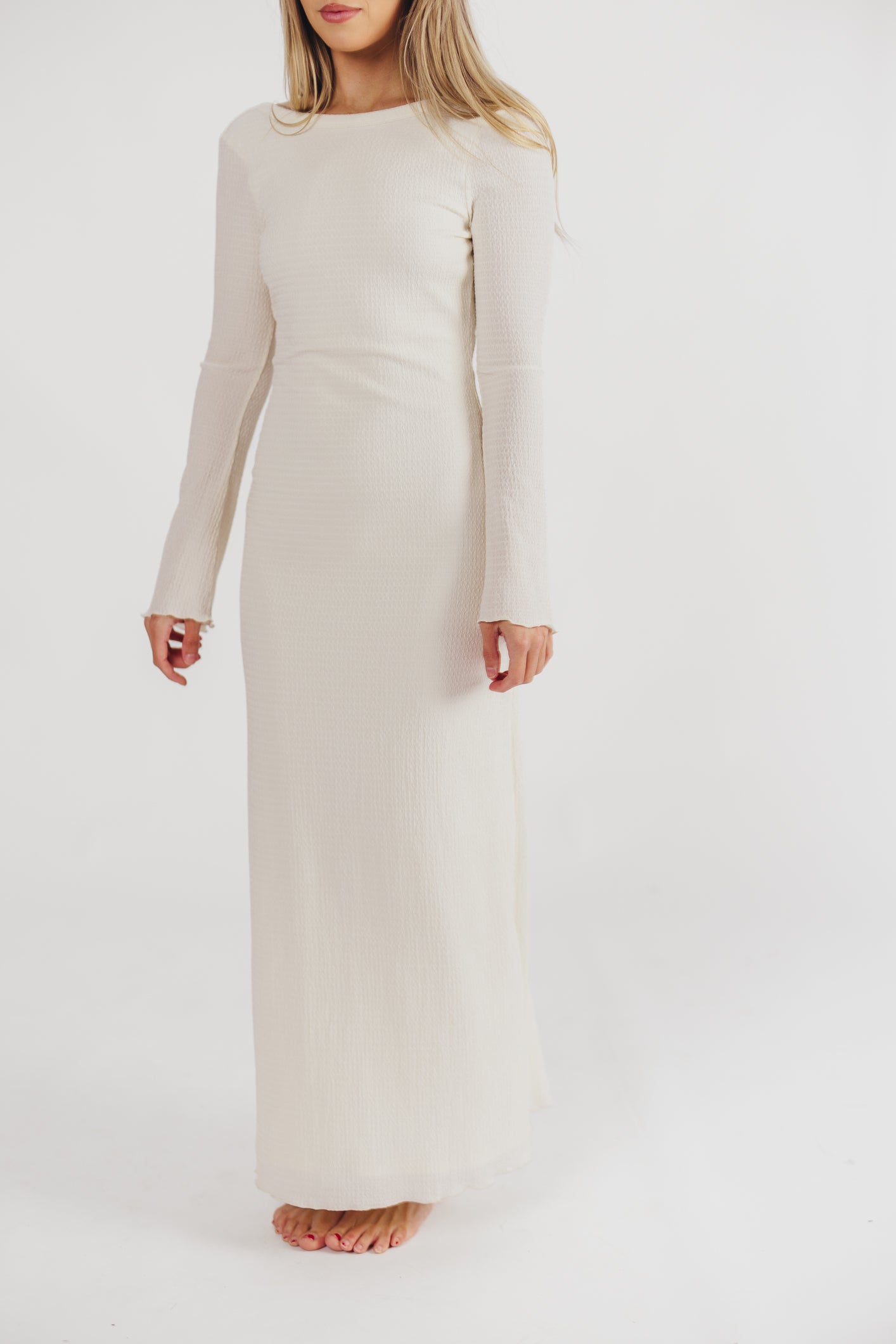 Cream textured maxi dress with bell sleeves front view