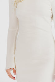 Cream textured maxi dress with bell sleeves close-up detail