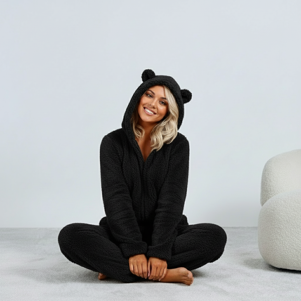 Black fuzzy onesie with bear ears seated view