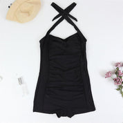 Badpak zwart met kruisbanden en ruchedetail vooraanzicht