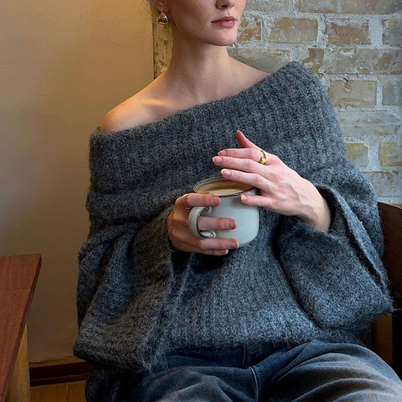 Gray off-shoulder knit sweater with coffee cup