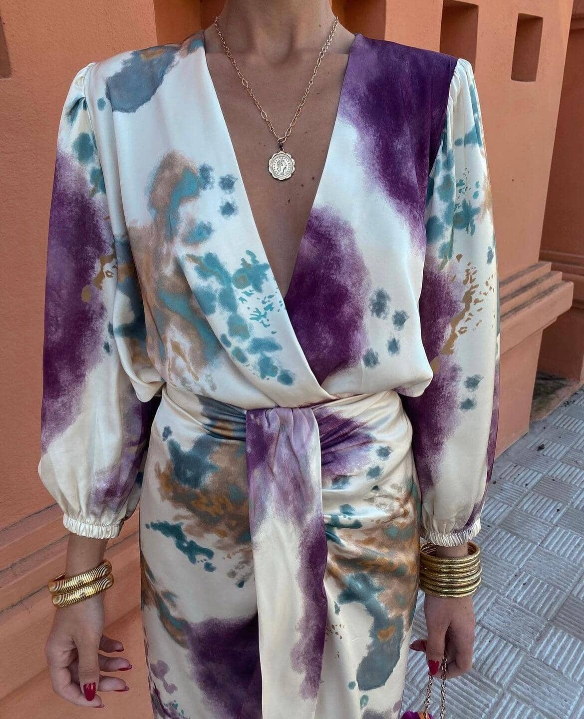 Silk dress with abstract print and deep V-neck close-up detail