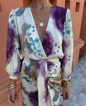 Silk dress with abstract print and deep V-neck close-up detail