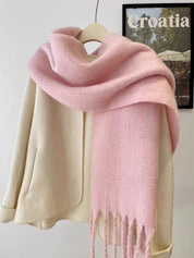 Pink scarf with fringe draped over mannequin front view