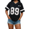 Black v-neck t-shirt with '89' and 'New York' graphic, front view