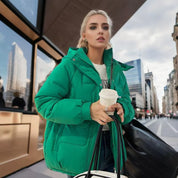 Puffer jacket green with hood urban setting