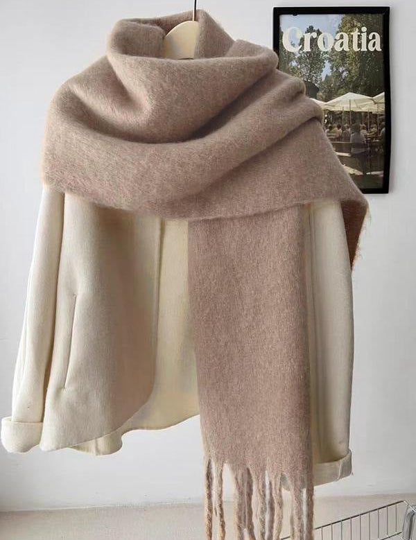 Beige scarf with fringe draped over mannequin front view