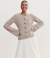 Knit vest beige with bell sleeves and brown buttons full body view