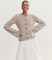Knit vest beige with bell sleeves and brown buttons full body view