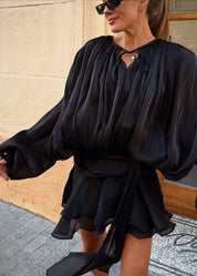 Black satin blouse with keyhole neck and peplum hem front view
