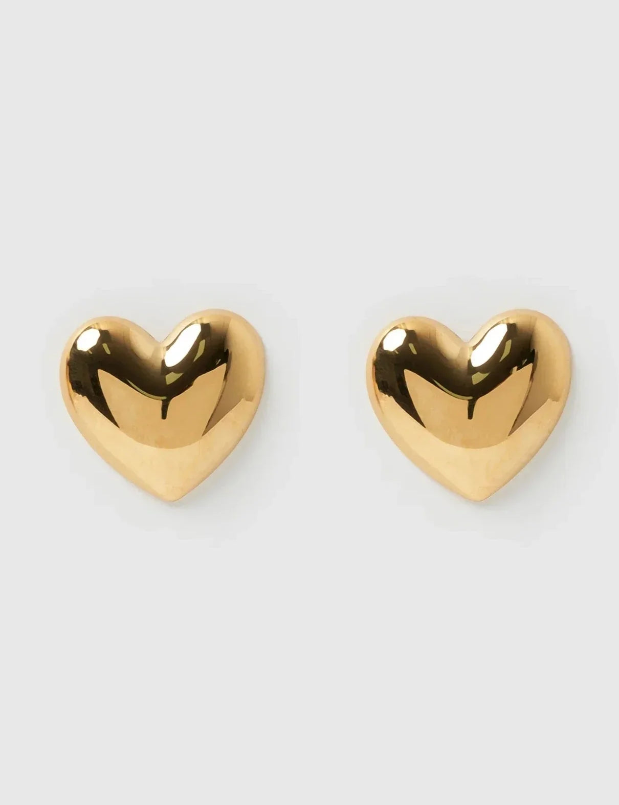 Gold heart-shaped stud earrings front view