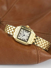 Gold wristwatch with Roman numerals and guilloche dial on brown leather background