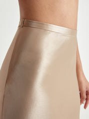 Midi skirt satin finish nude close-up waist detail