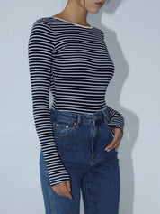 Striped long-sleeve top with deep low back, side view
