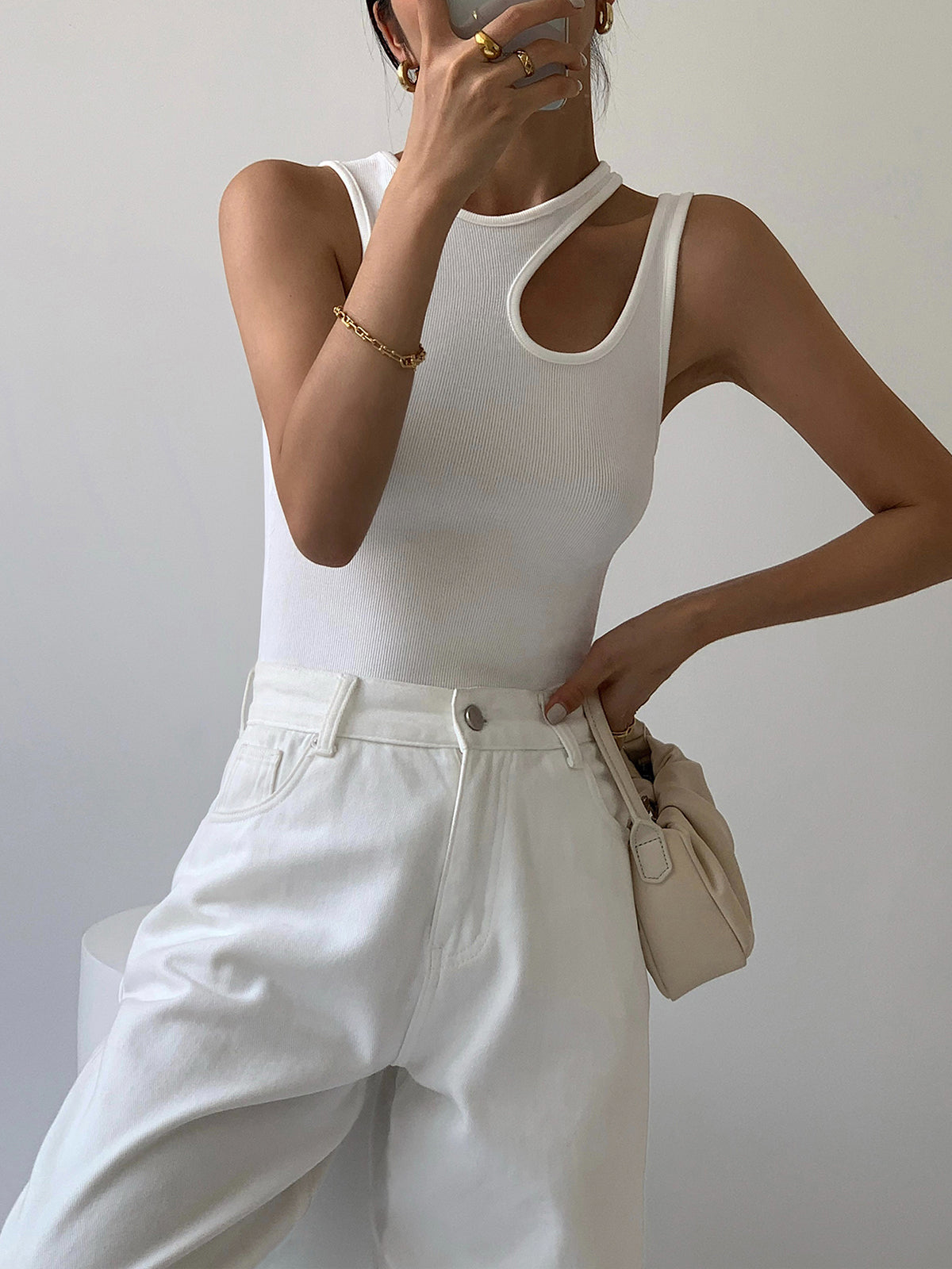 White tank top with asymmetrical neckline front view with accessories