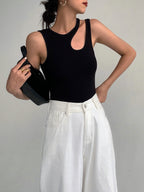 Black tank top with asymmetrical neckline front view with accessories