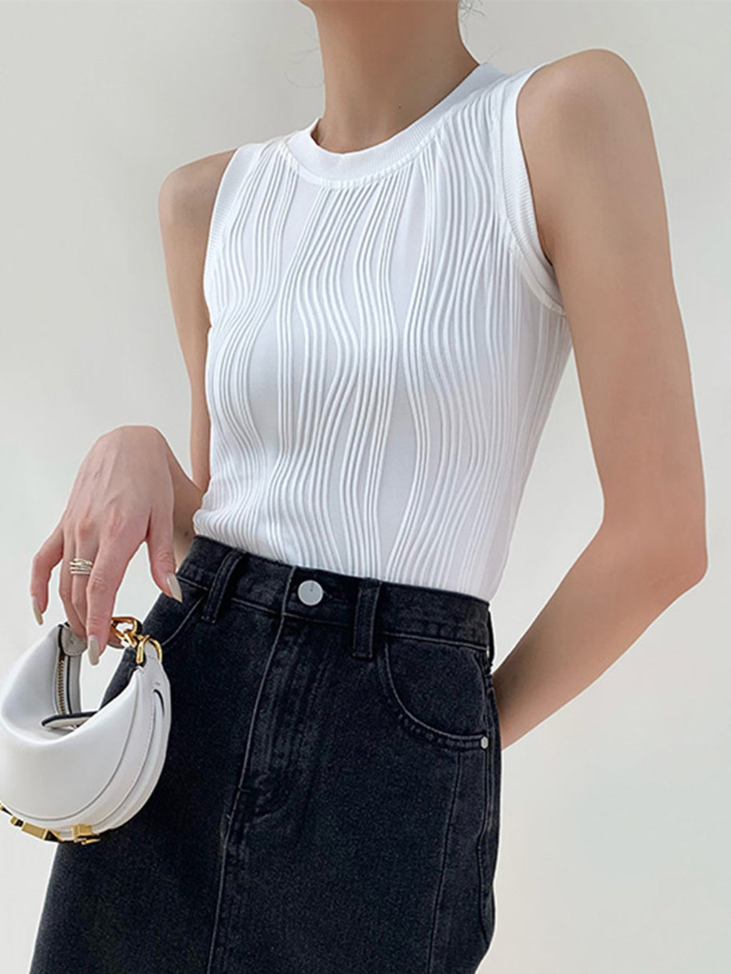White ribbed sleeveless top with denim jeans front view