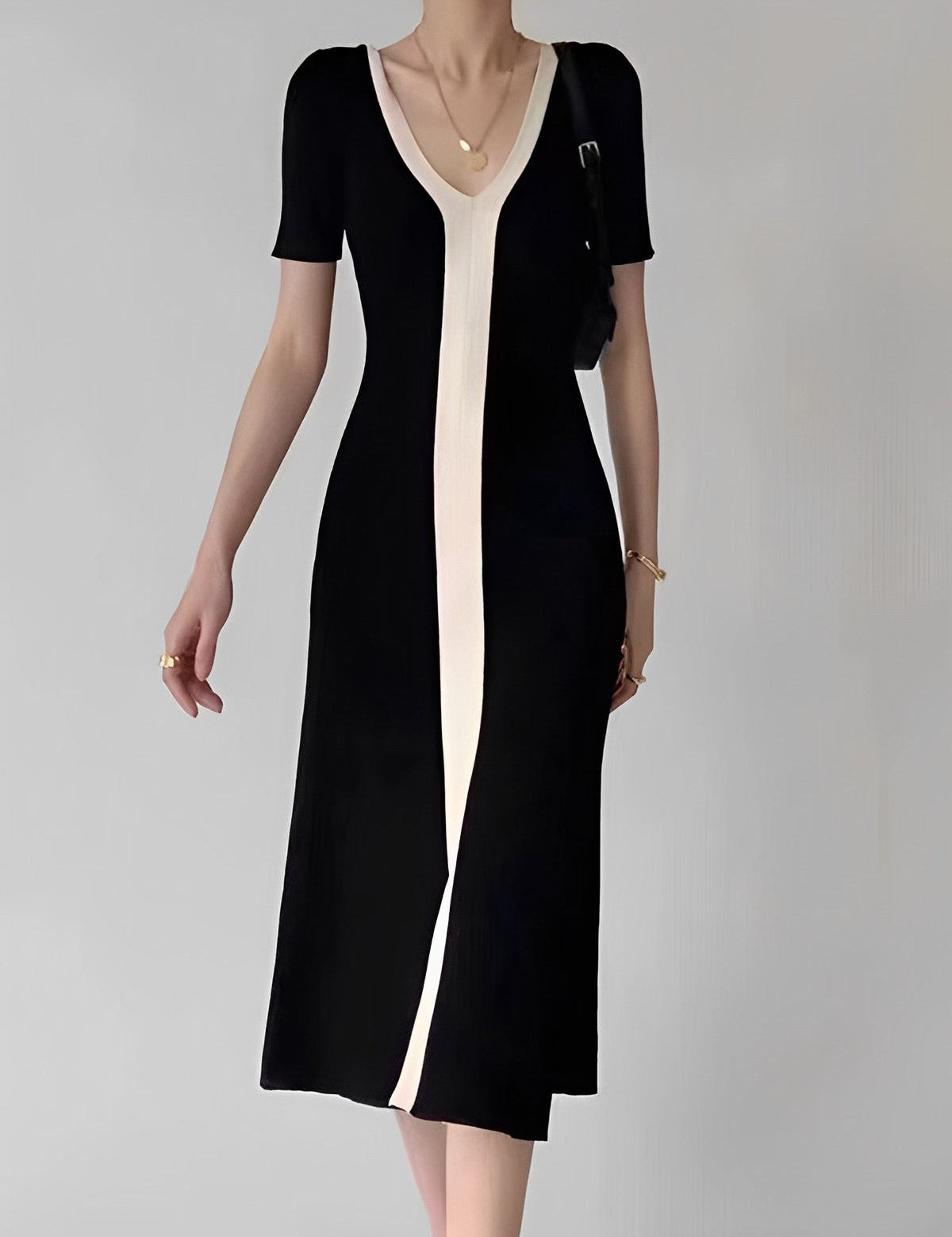 Black and white striped dress with V-neck front view