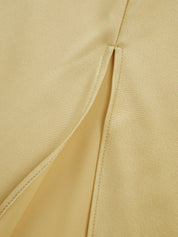 Evening dress yellow split detail close-up