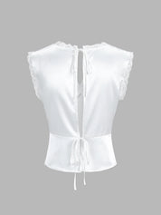White satin top with lace trim and back tie, back view