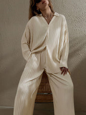 Cream pleated two-piece set seated view