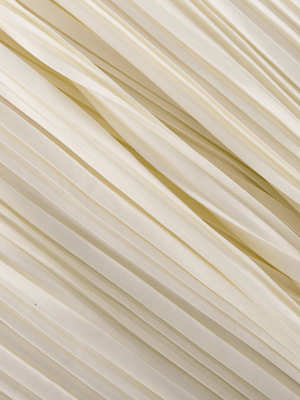 Close-up of cream pleated fabric detail