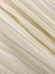 Close-up of cream pleated fabric detail