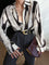 Casual blouse with abstract black and white print, front view