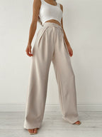 Damesbroek lichtgrijs met hoge taille en riemzakken front view