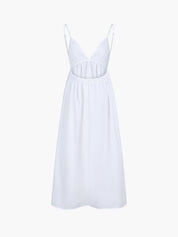 White summer dress with open back, studio side view