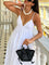 White summer dress with open back, side profile