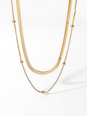 Gold necklace, double strand design, snake chain texture, pendant beads, isolated view
