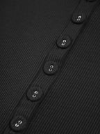 Black ribbed crop top buttons close-up detail