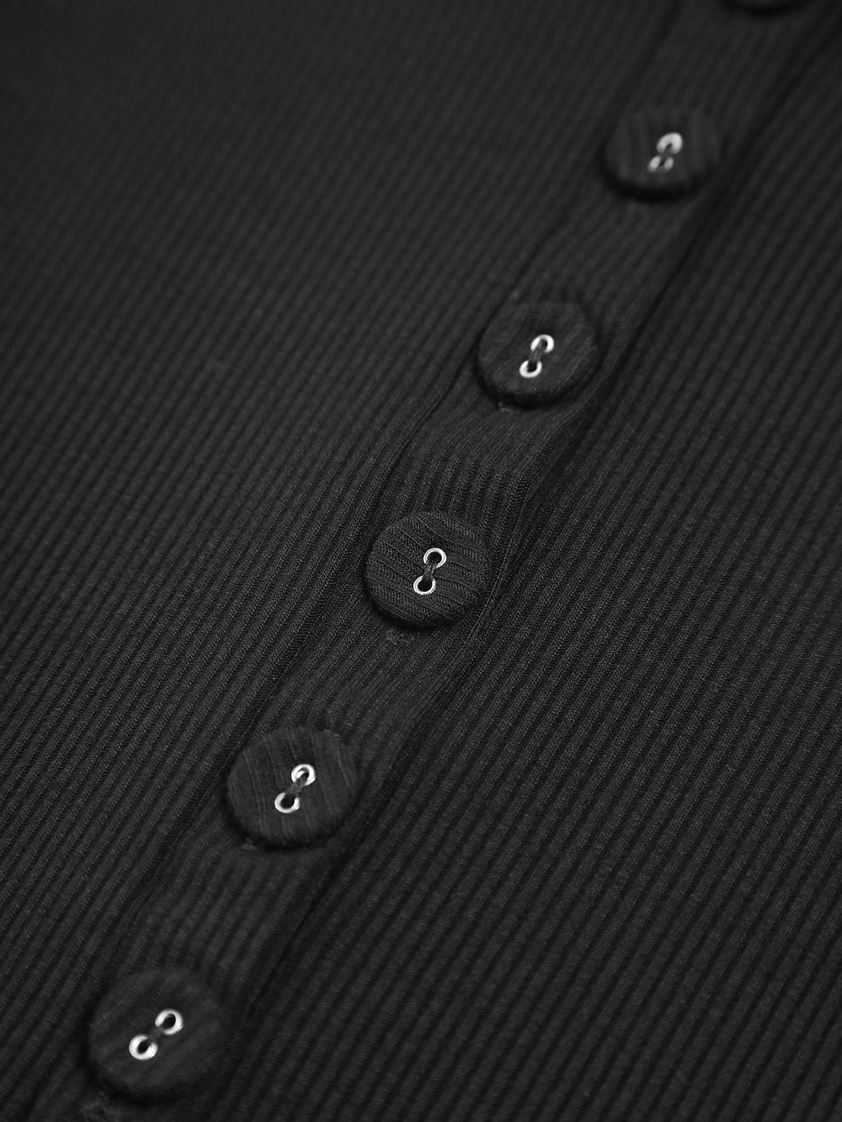 Black ribbed crop top buttons close-up detail