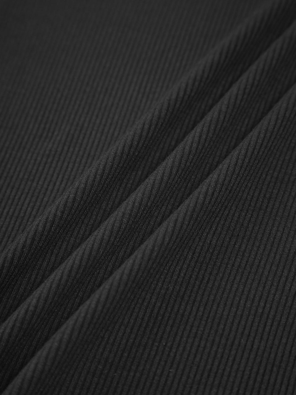 Black ribbed crop top fabric texture close-up
