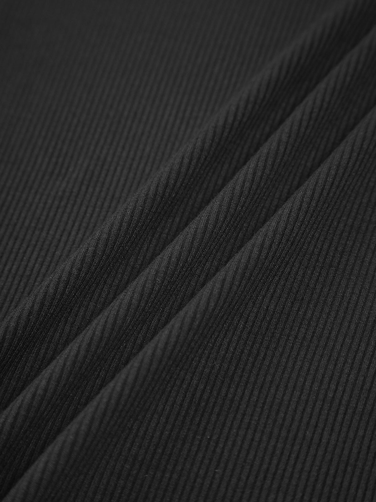 Black ribbed crop top fabric texture close-up