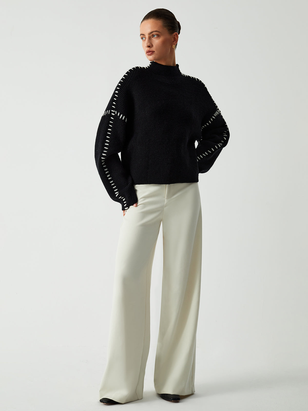 Black ribbed sweater with white dotted trim full body view