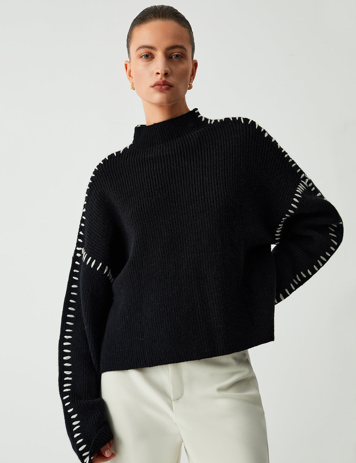 Black ribbed sweater with white dotted trim front view
