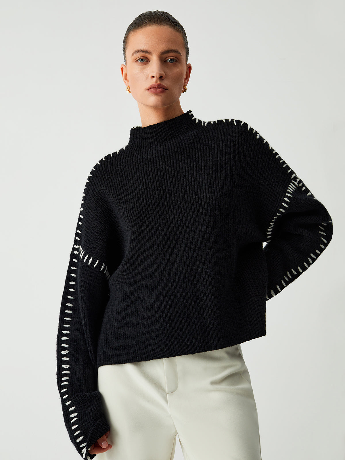 Black ribbed sweater with white dotted trim front view