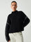 Black ribbed sweater with white dotted trim front view