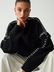 Black ribbed sweater with white dotted trim posed view